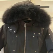 Black hooded jacket with fur trim, zip closure and front pockets